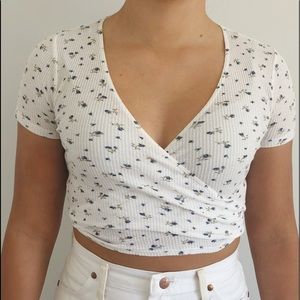 Brandy Melville white Rae top with blue flowers